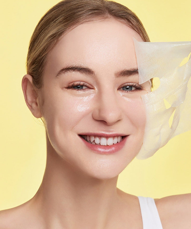 Smiling woman using GENABELLE Glutathione Brightening Ampoule Mask 5ea for skincare routine