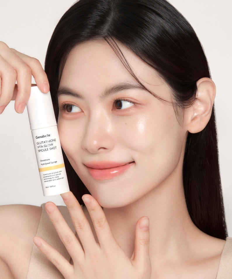 Woman holding GENABELLE Glutathione Vita Glow Spicule Shot 30ml skincare product, highlighting glowing skin and product bottle.