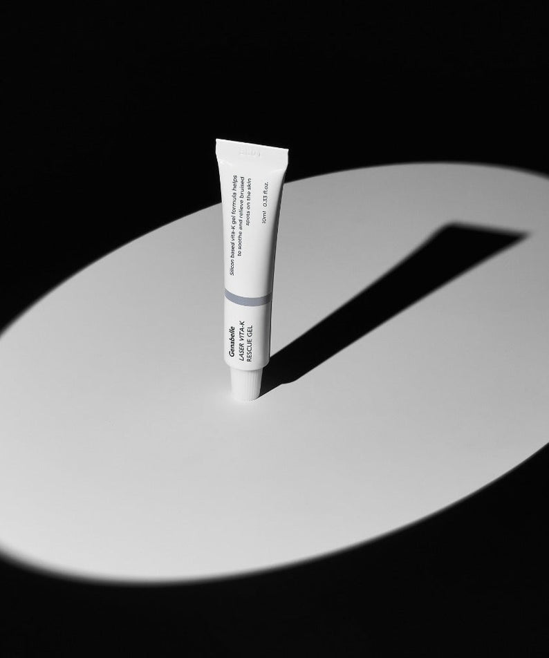 GENABELLE Laser Vita-K Rescue Gel 10ml skincare product in focus on a dramatic black and white background.
