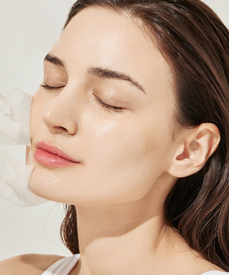 Woman applying GENABELLE PDRN Rejuvenating Mask 5ea for glowing skin