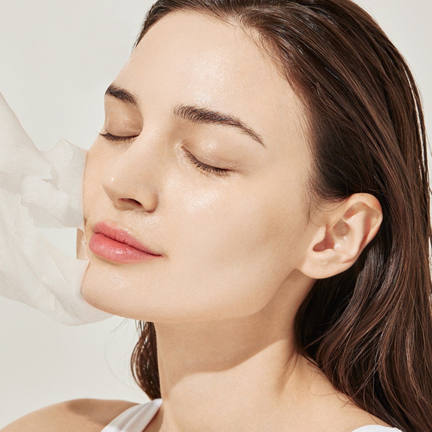 Woman applying GENABELLE PDRN Rejuvenating Mask 5ea for glowing skin
