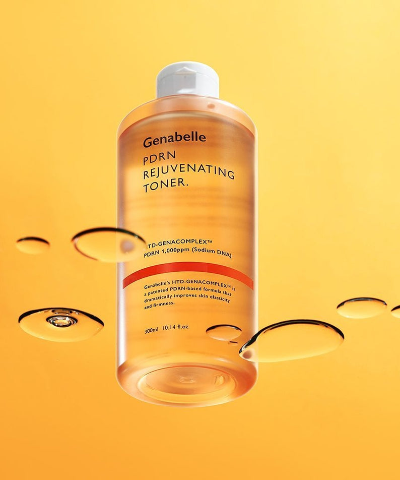 GENABELLE PDRN Rejuvenating Toner 300ml bottle against orange background with liquid droplets