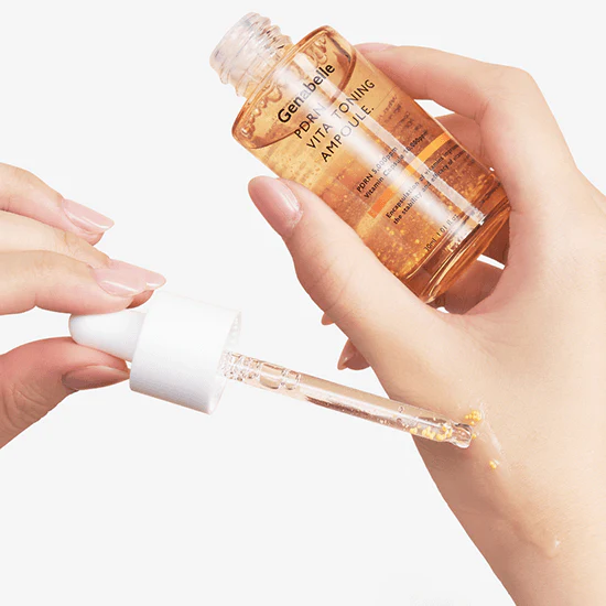 Applying GENABELLE PDRN Vita Toning Ampoule 30ml with a dropper on skin