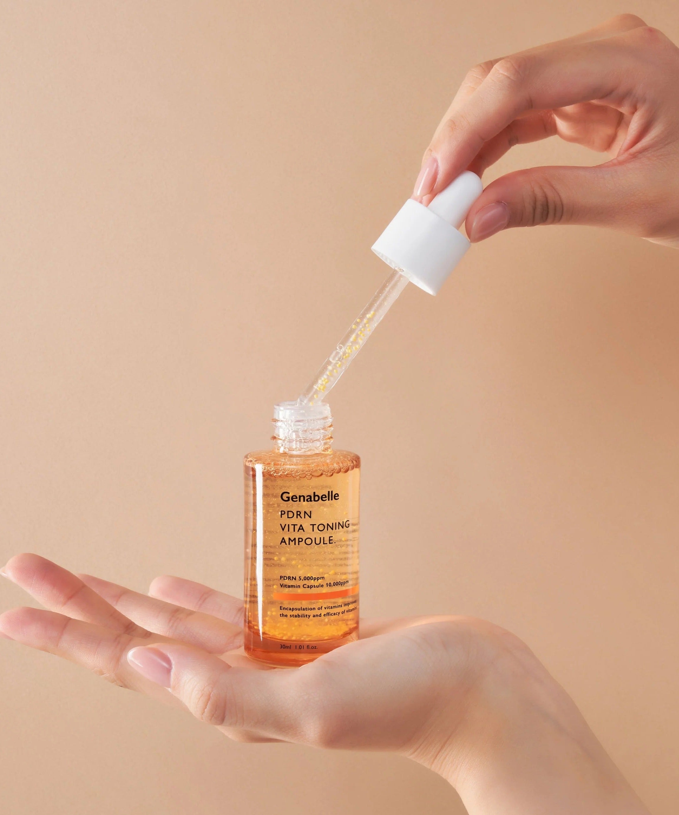 GENABELLE PDRN Vita Toning Ampoule 70ml being applied from dropper onto hand