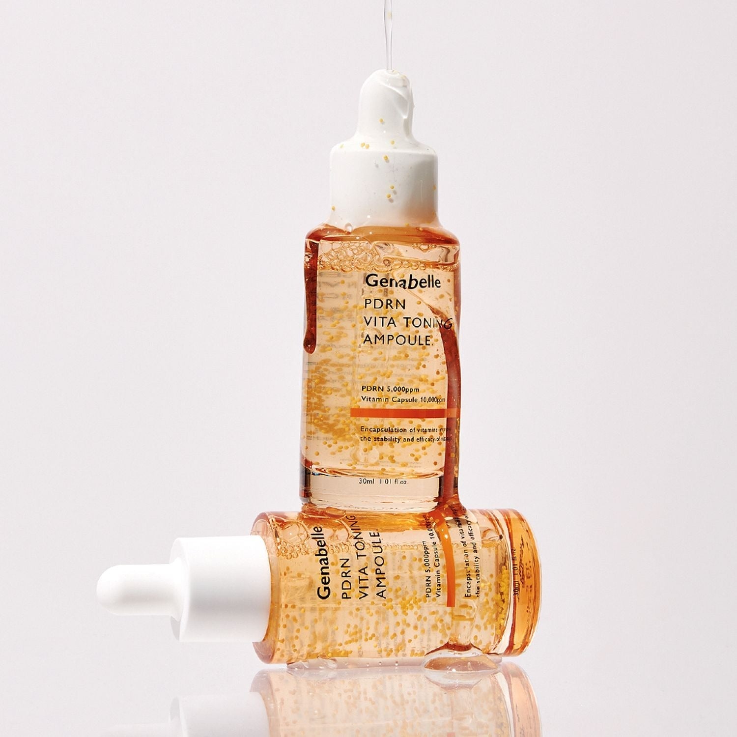 GENABELLE PDRN Vita Toning Ampoule 70ml bottles displayed with clear, reflective surface, highlighting the product's premium quality and design.