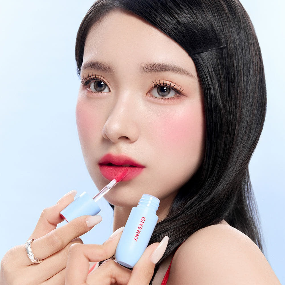 Woman applying GIVERNY Fluffy Sheer Tint 3.5g lipstick