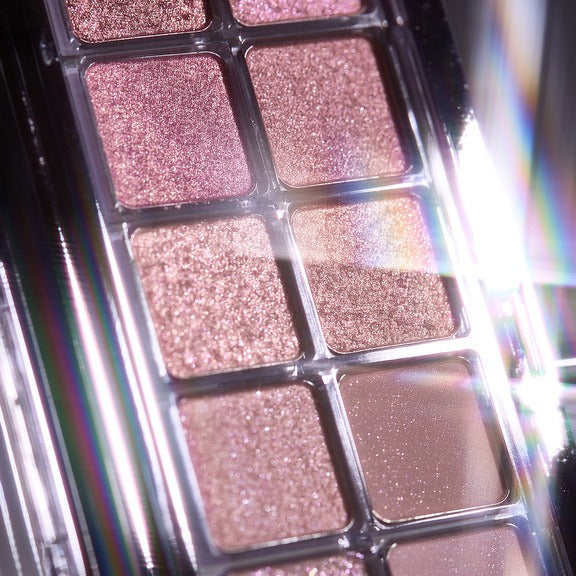 Close-up of GLOW Anime Eyeshadow Palette showcasing shimmering shades with vibrant sparkle and texture.