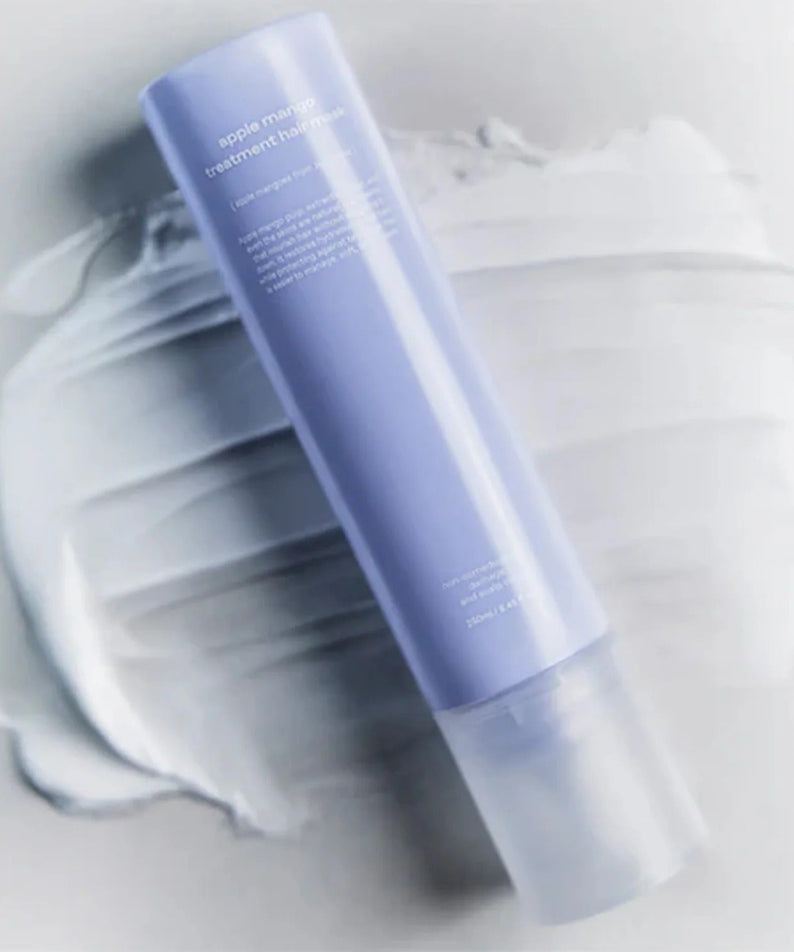 GLOW Apple Mango Hair Treatment 250ml on a white textured background.