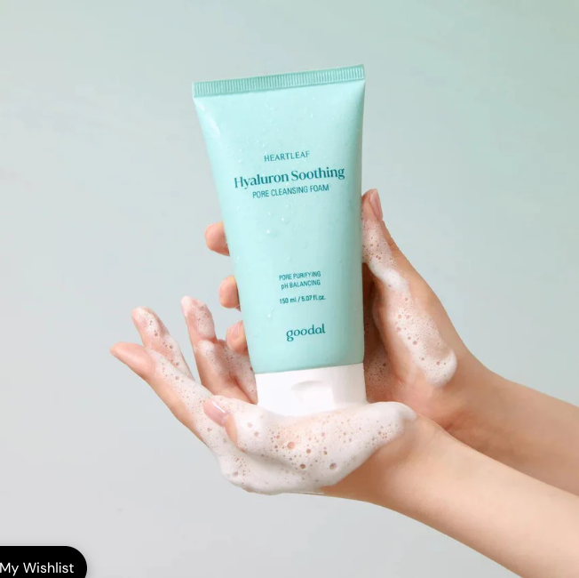 Person holding GOODAL Eoseongdho Hyaluronic Soothing Pore Cleansing Foam 150ml with foamy texture, showcasing product packaging.