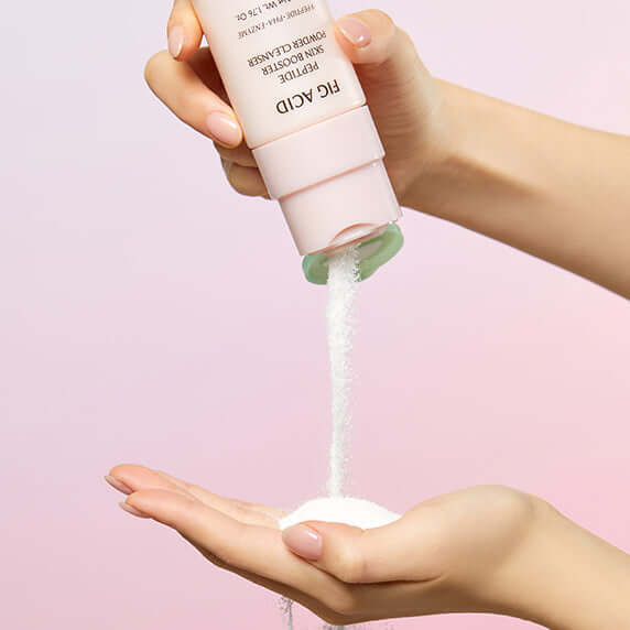 Person using GOODAL Fig Acid Peptide Skin Booster Powder Cleanser, pouring powder onto hand.
