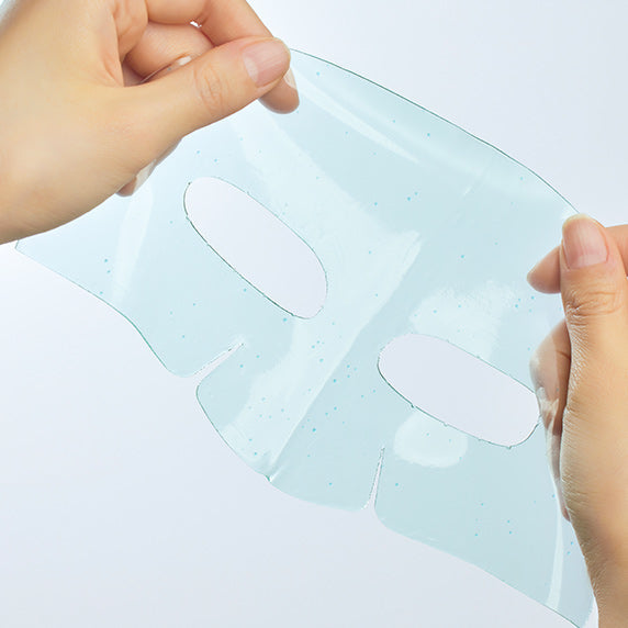 Person holding GOODAL Gel Mask (Green Tangerine/Eoseongcho) showing mask texture and cutouts