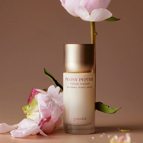 GOODAL Peony Peptide Wrinkle Volume Ampoule 50ml with blooming peonies in a soothing setting.