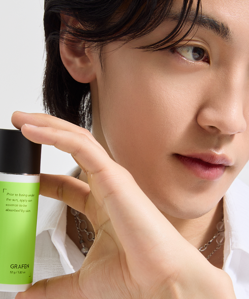 GRAFEN Daily Sun Essence 52g held by a Korean gentleman model, Gentleman Korea sun protection for men skincare