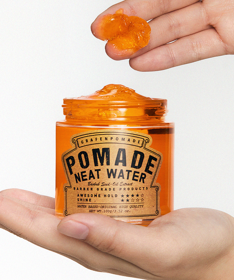 GRAFEN Pomande Neat Water 100g in open amber jar held by hands, glossy orange pomade scoop for men - Gentleman Korea