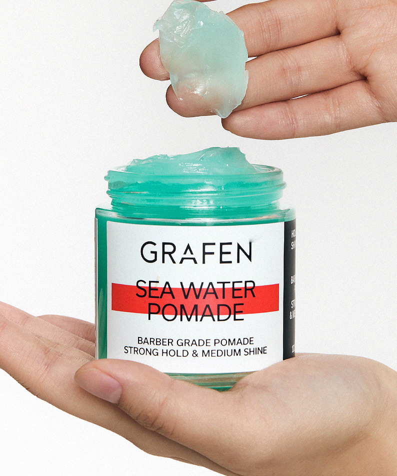 GRAFEN Sea Water Pomade 100g open jar held in hands showing aqua gel texture for men by Gentleman Korea