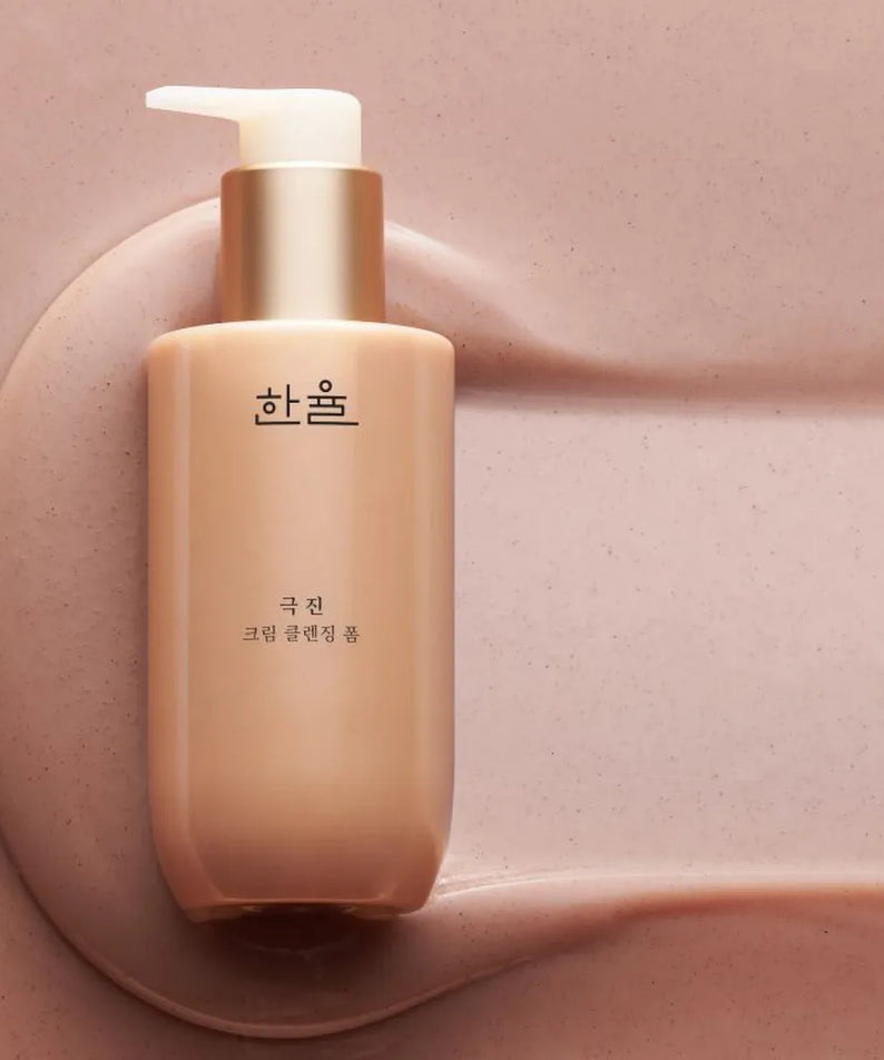 HANYUL Extreme Cream Cleansing Foam 200ml in pink setting, luxury skincare product with pump dispenser