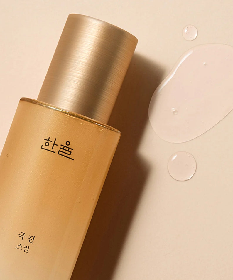 HANYUL Extreme Skin 125ml bottle on beige background with droplets