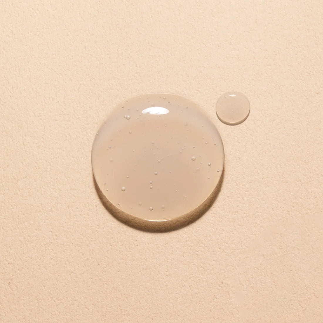 Texture of HANYUL Extreme Skin 125ml serum on a neutral background