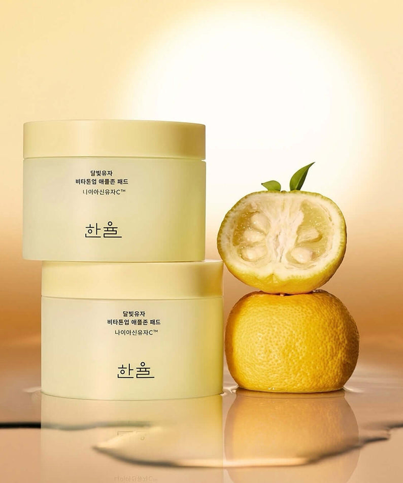 HANYUL Moonlight Yuja Vita Tone Up Apple Zone Pad in yellow packaging with yuja fruit, enhancing skin vitality and tone.