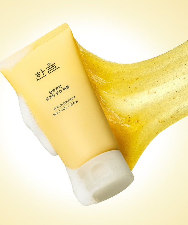 HANYUL Moonlight Yuja Vitamin Tone-Up Pack Foam 120ml with foaming gel texture on a yellow background