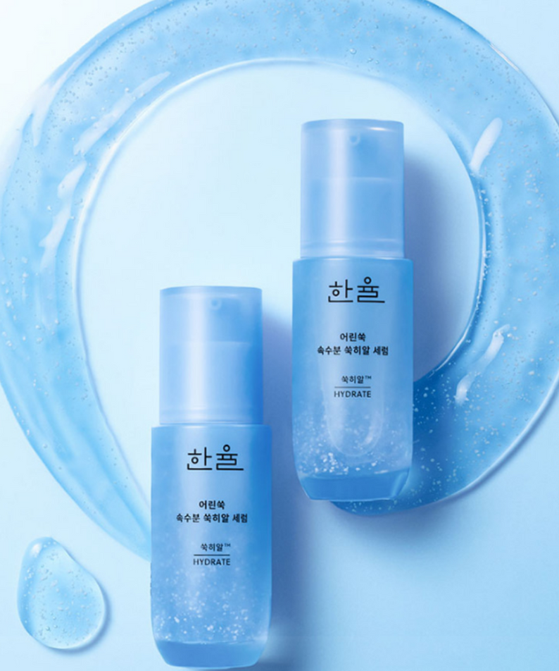HANYUL Young Artemisia Extract Moisturizing Serum 40ml bottles with droplets and splash design on a blue background