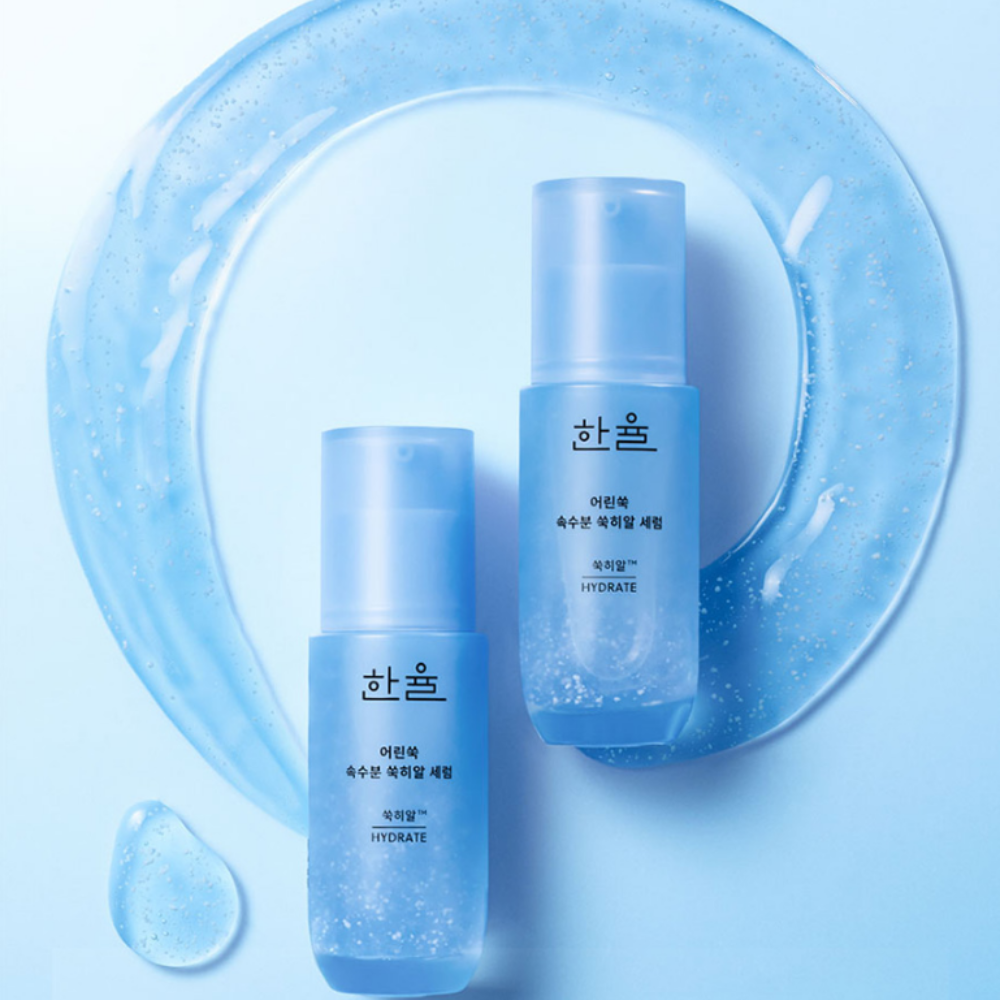 HANYUL Young Artemisia Extract Moisturizing Serum 40ml bottles with droplets and splash design on a blue background