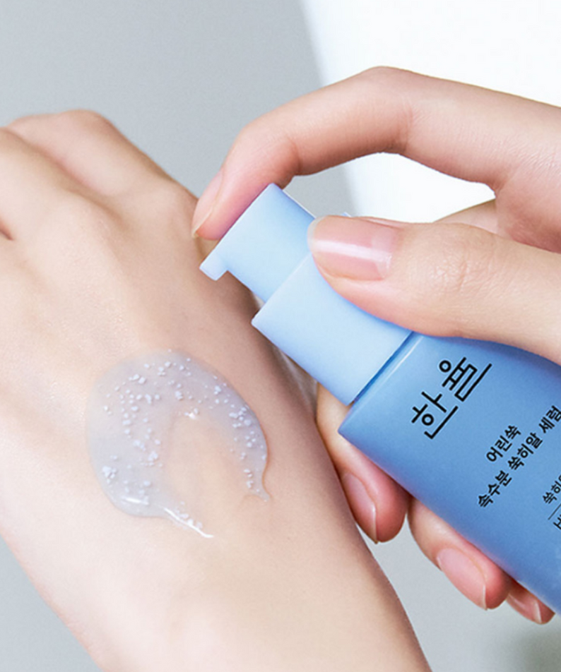 Applying HANYUL Young Artemisia Extract Moisturizing Serum 40ml on hand to show texture and consistency.
