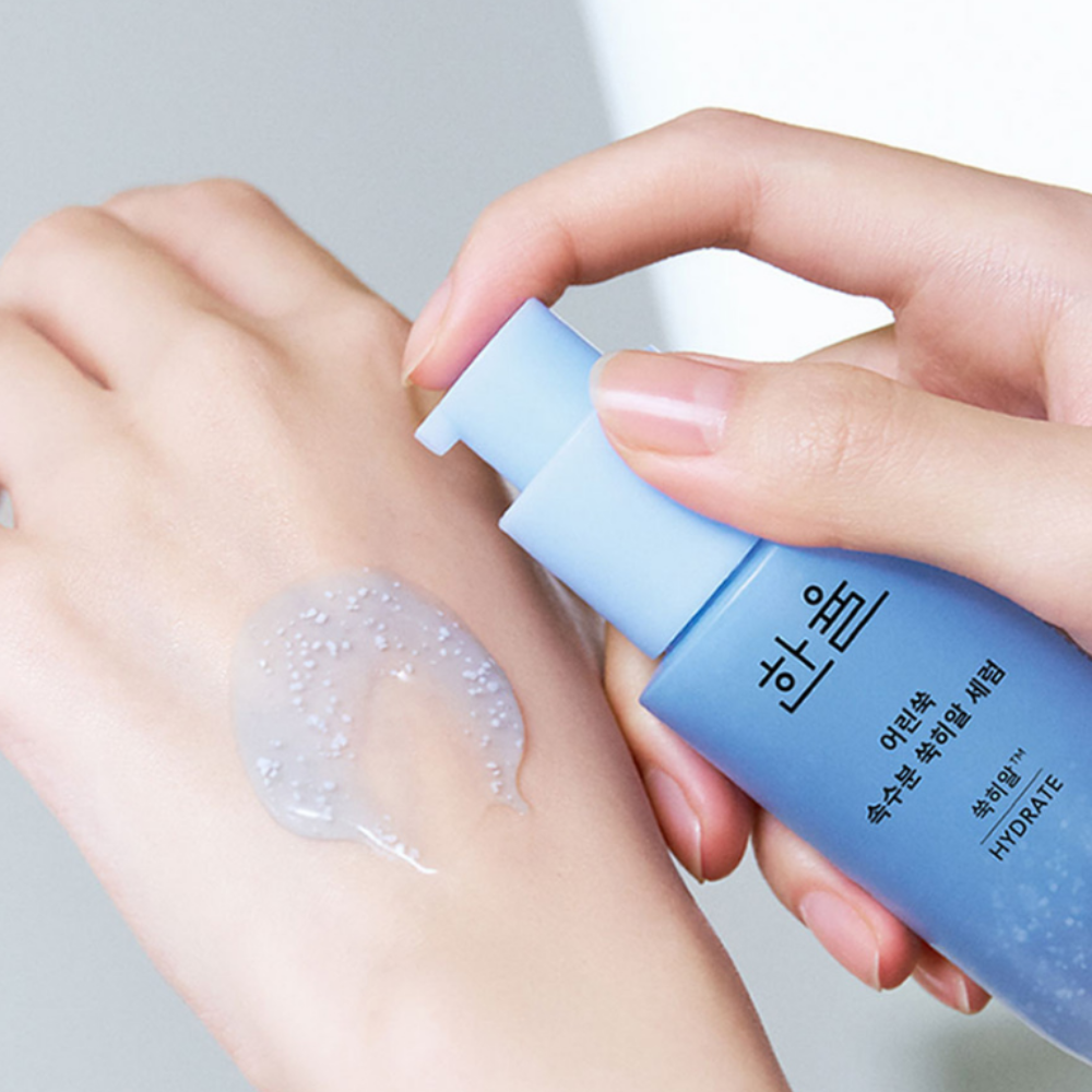 Applying HANYUL Young Artemisia Extract Moisturizing Serum 40ml on hand to show texture and consistency.