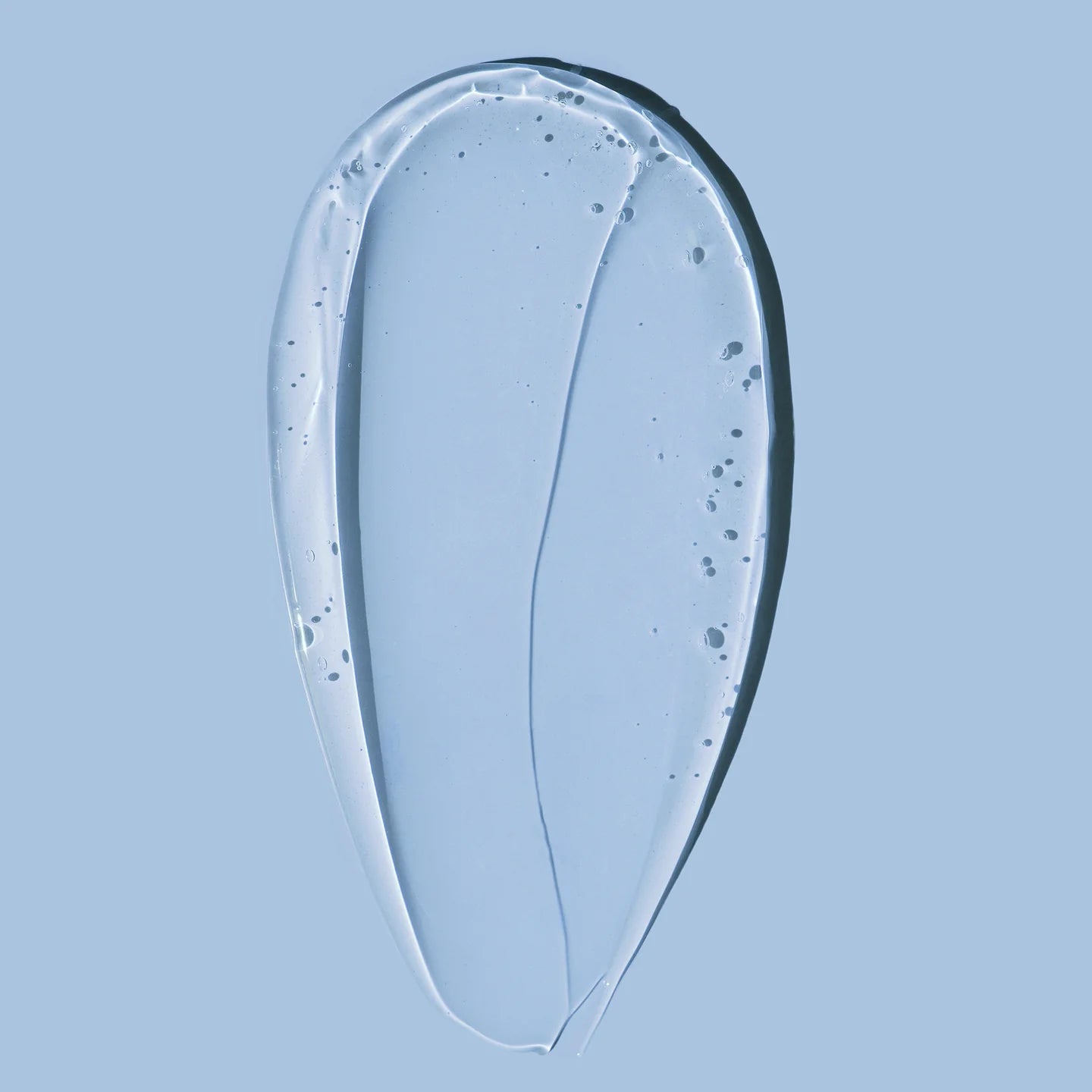 Texture of HARU HARU Black Rice Hyaluronic Essence 50ml on a blue background