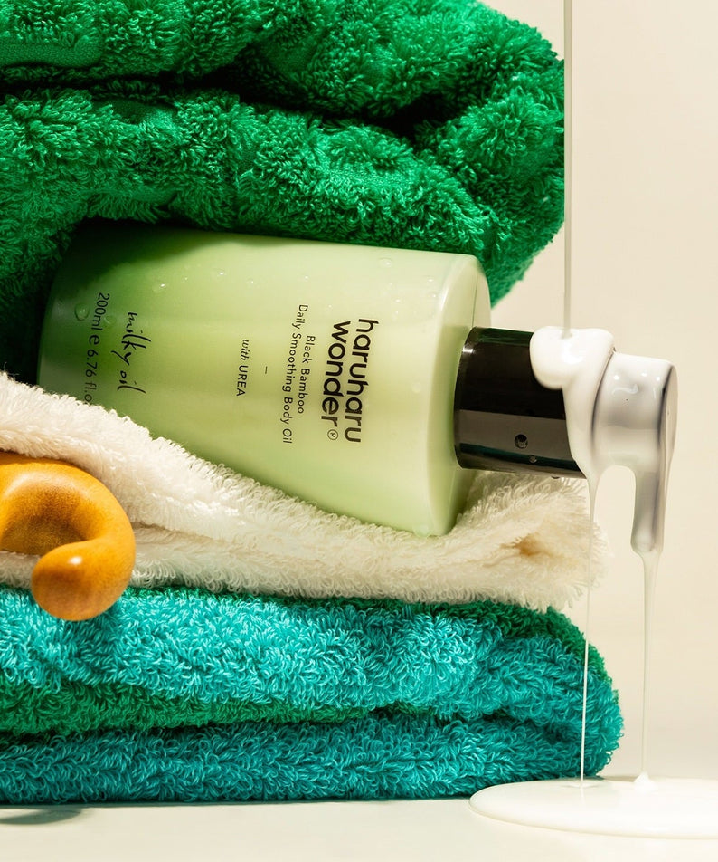HARUHARU Black Bamboo Daily Smoothing Body Oil 200ml bottle on towels