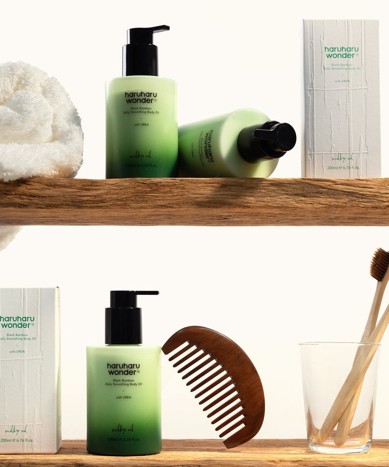 HARUHARU Black Bamboo Daily Smoothing Body Oil 200ml with skincare set, featuring packaging and natural wooden comb and toothbrushes.