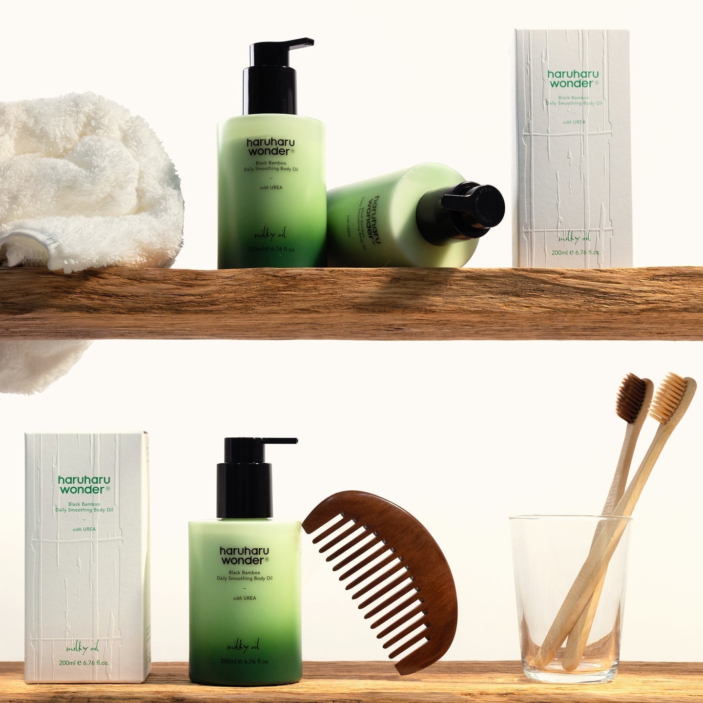 HARUHARU Black Bamboo Daily Smoothing Body Oil 200ml with skincare set, featuring packaging and natural wooden comb and toothbrushes.