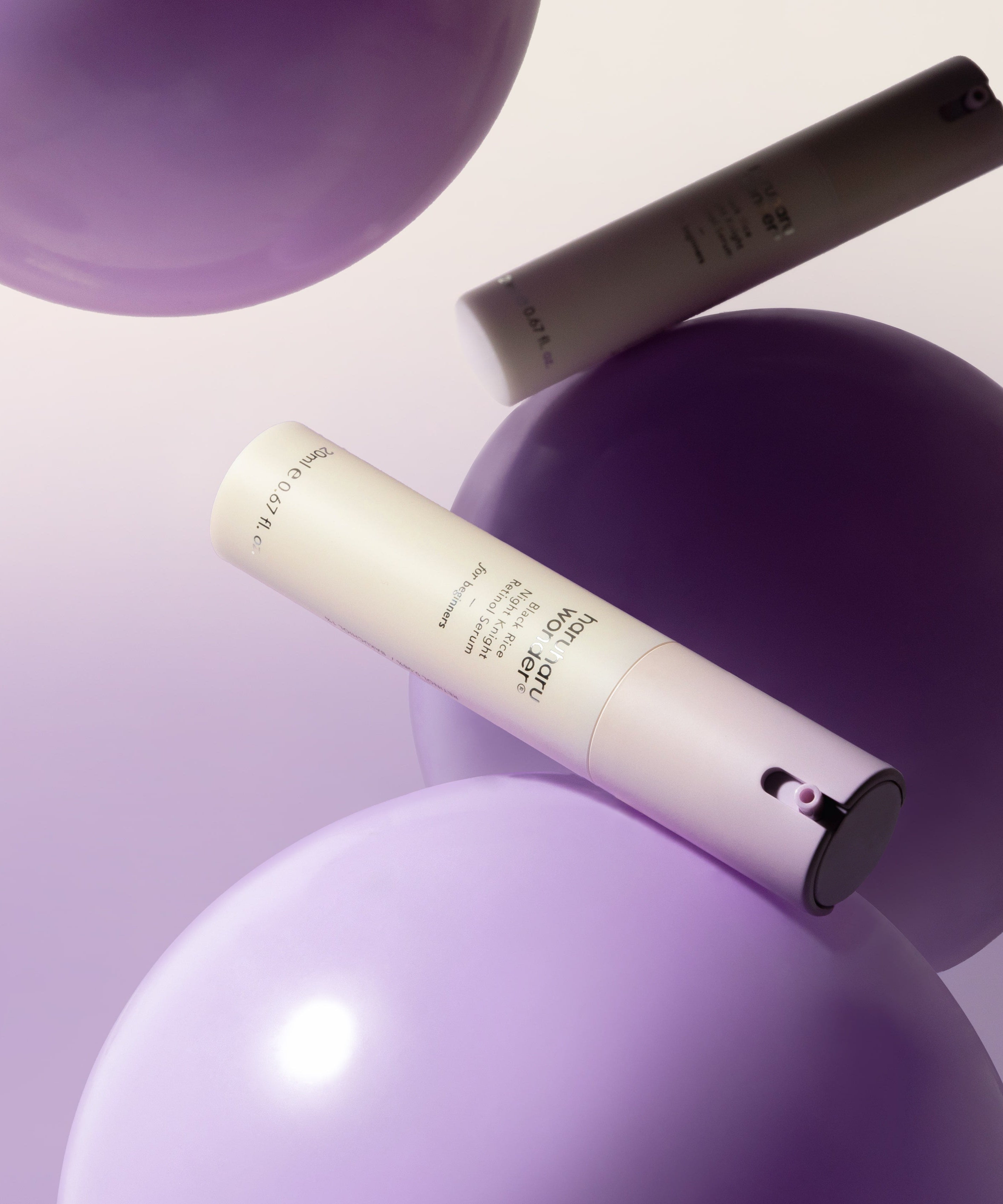 HARUHARU Black Rice Night Night Retinol Serum 20ml on purple background with floating spheres