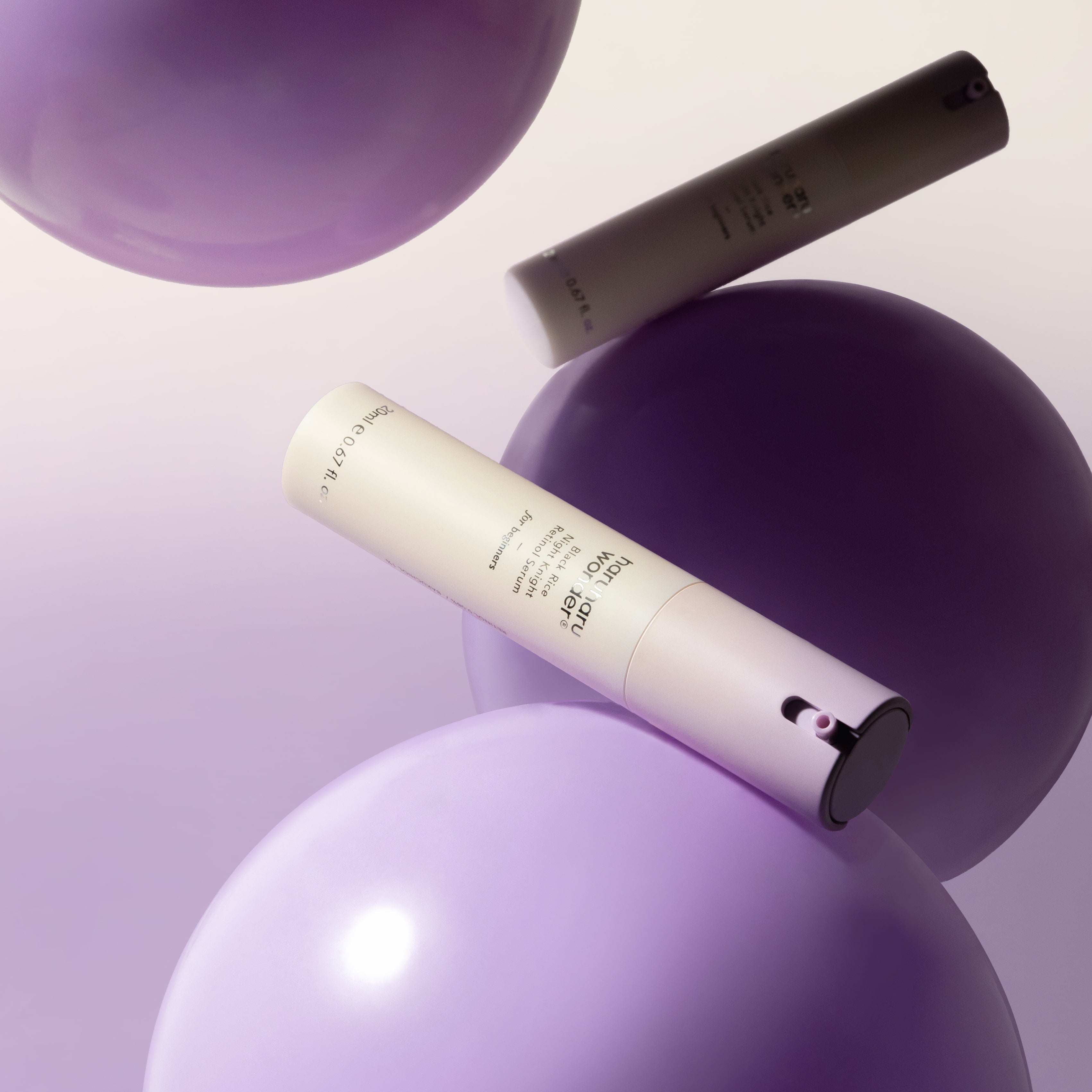HARUHARU Black Rice Night Night Retinol Serum 20ml on purple background with floating spheres