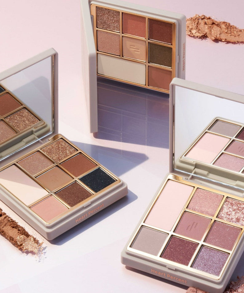 HEART PERCENT Dot On Mood Eye Palette featuring multiple shades with mirror and case, perfect for creating versatile eye makeup looks.