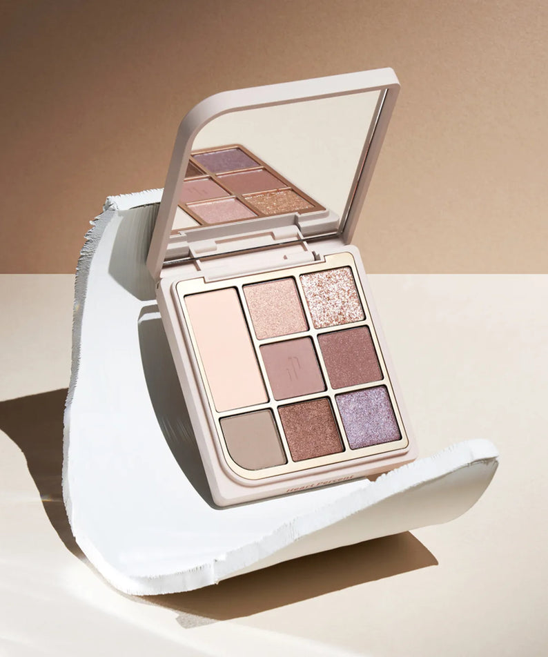 HEART PERCENT Dot On Mood Eye Palette featuring neutral and shimmer shades with elegant packaging.