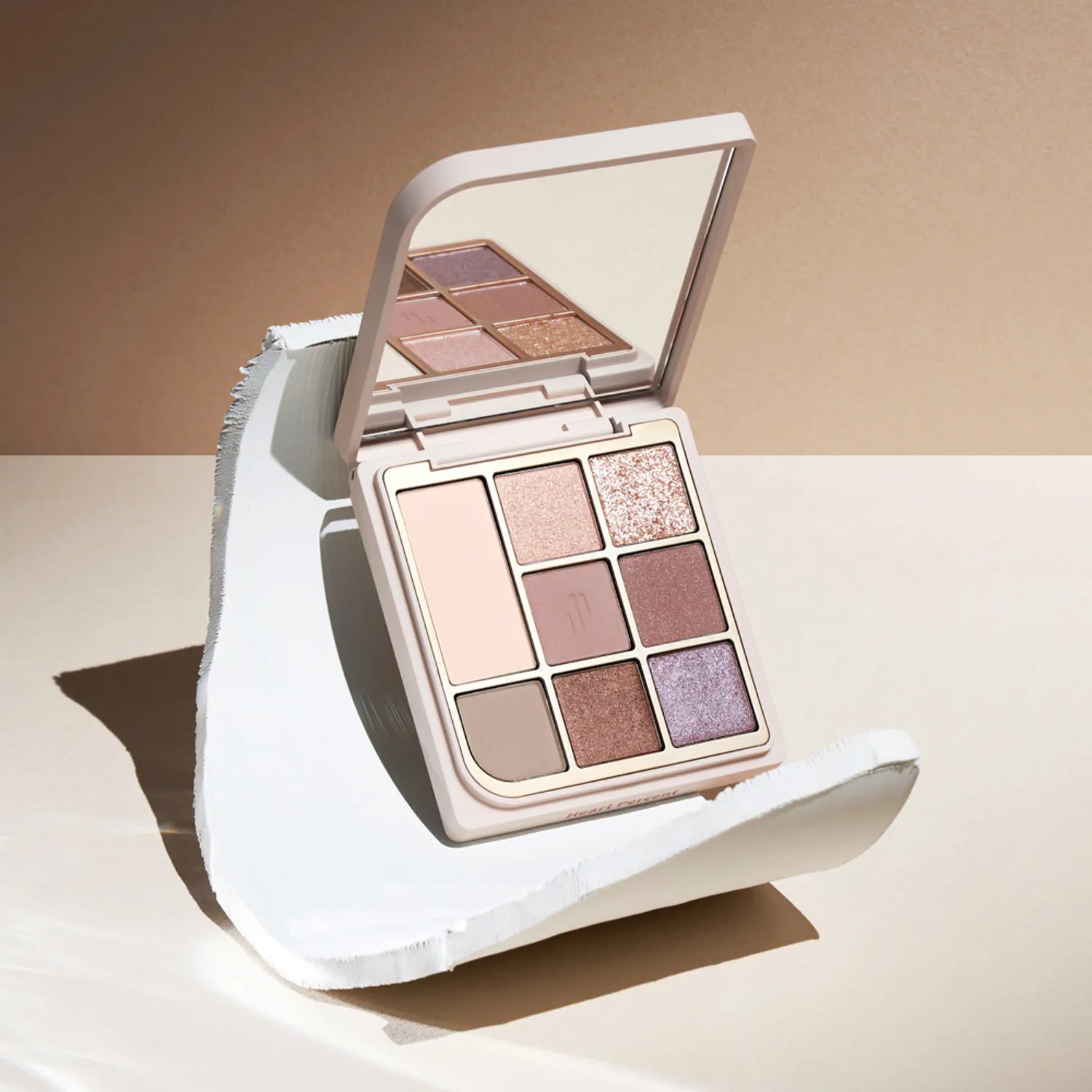 HEART PERCENT Dot On Mood Eye Palette featuring neutral and shimmer shades with elegant packaging.