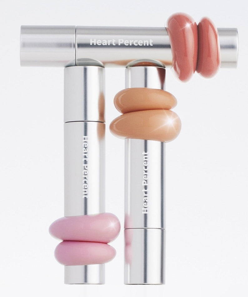 HEART PERCENT Dot On Mood One Way Glow Tint in various shades displayed with stylish packaging.