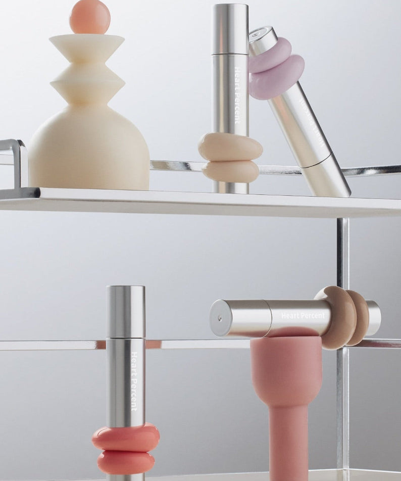 Stylish display of HEART PERCENT Dot On Mood One Way Glow Tint in modern packaging, highlighting trendy aesthetic and elegance.