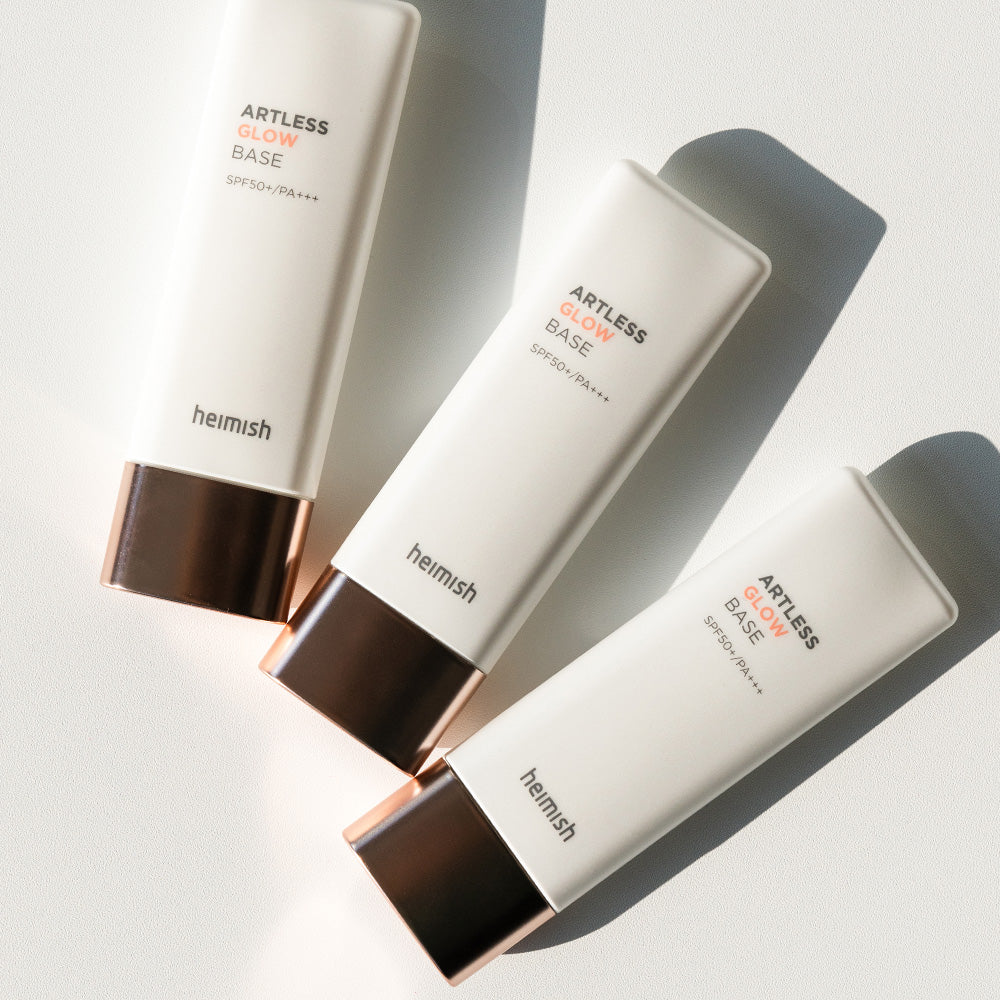 HEIMISH Artless Glow Base 40ml tubes on white background, SPF protection, skin-enhancing primer for fresh makeup look.