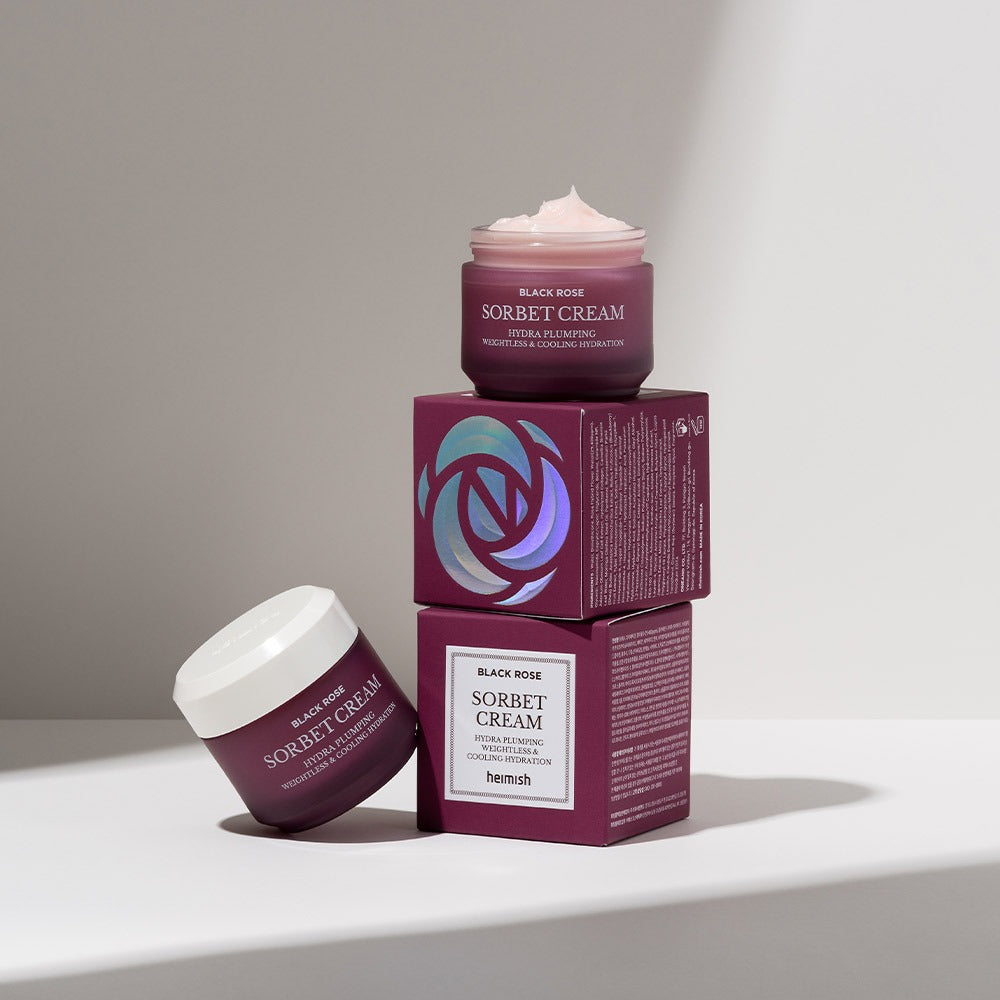 HEIMISH Black Rose Hydra Plumping Shavet Cream 50ml product packaging displayed on stacked boxes