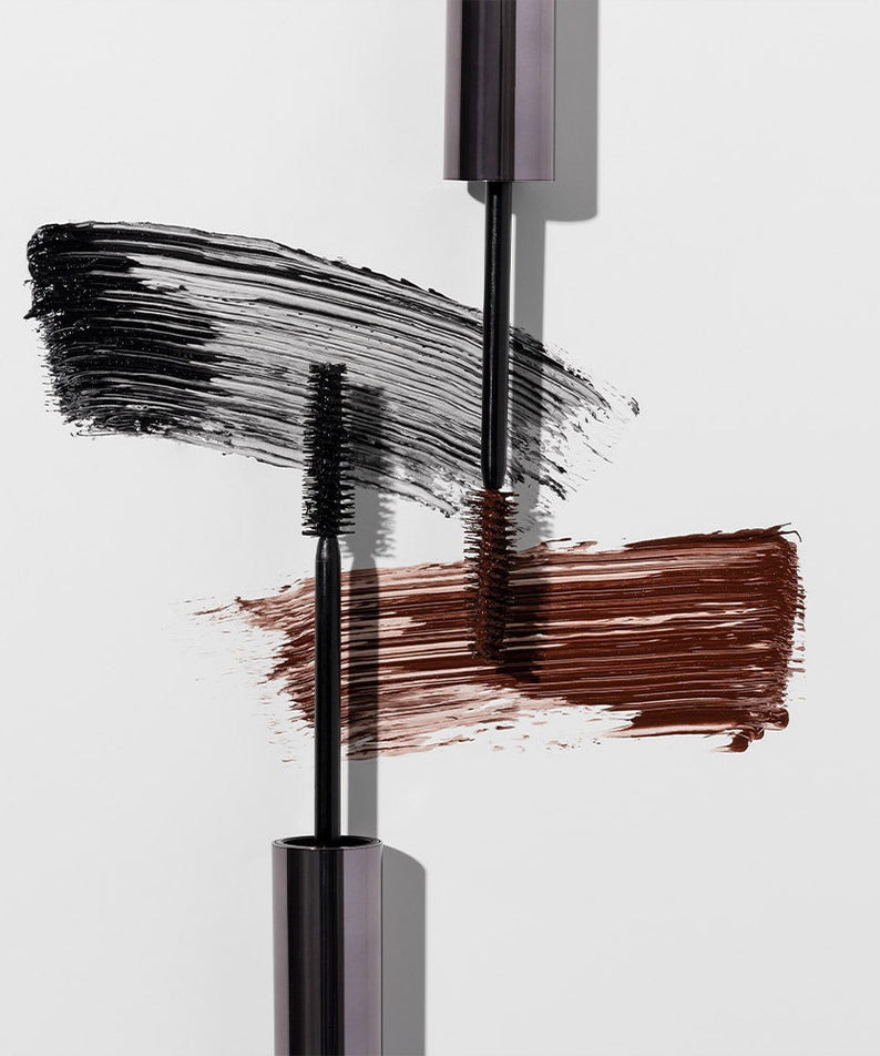HEIMISH Dailism Mascara in black and brown brush strokes on a white background
