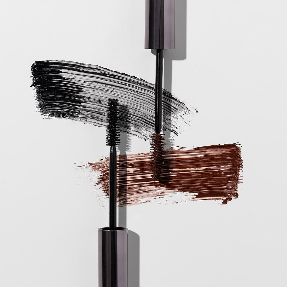 HEIMISH Dailism Mascara in black and brown brush strokes on a white background
