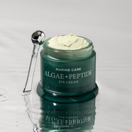 HEIMISH Marine Care Algae+Panthenol Eye Cream 30ml in an open jar on a reflective surface
