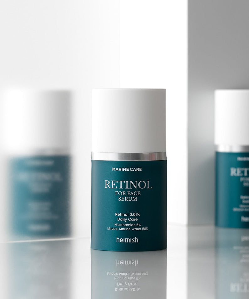 HEIMISH Marine Care Retinol For Face Serum 50ml in a sleek bottle on reflective surface