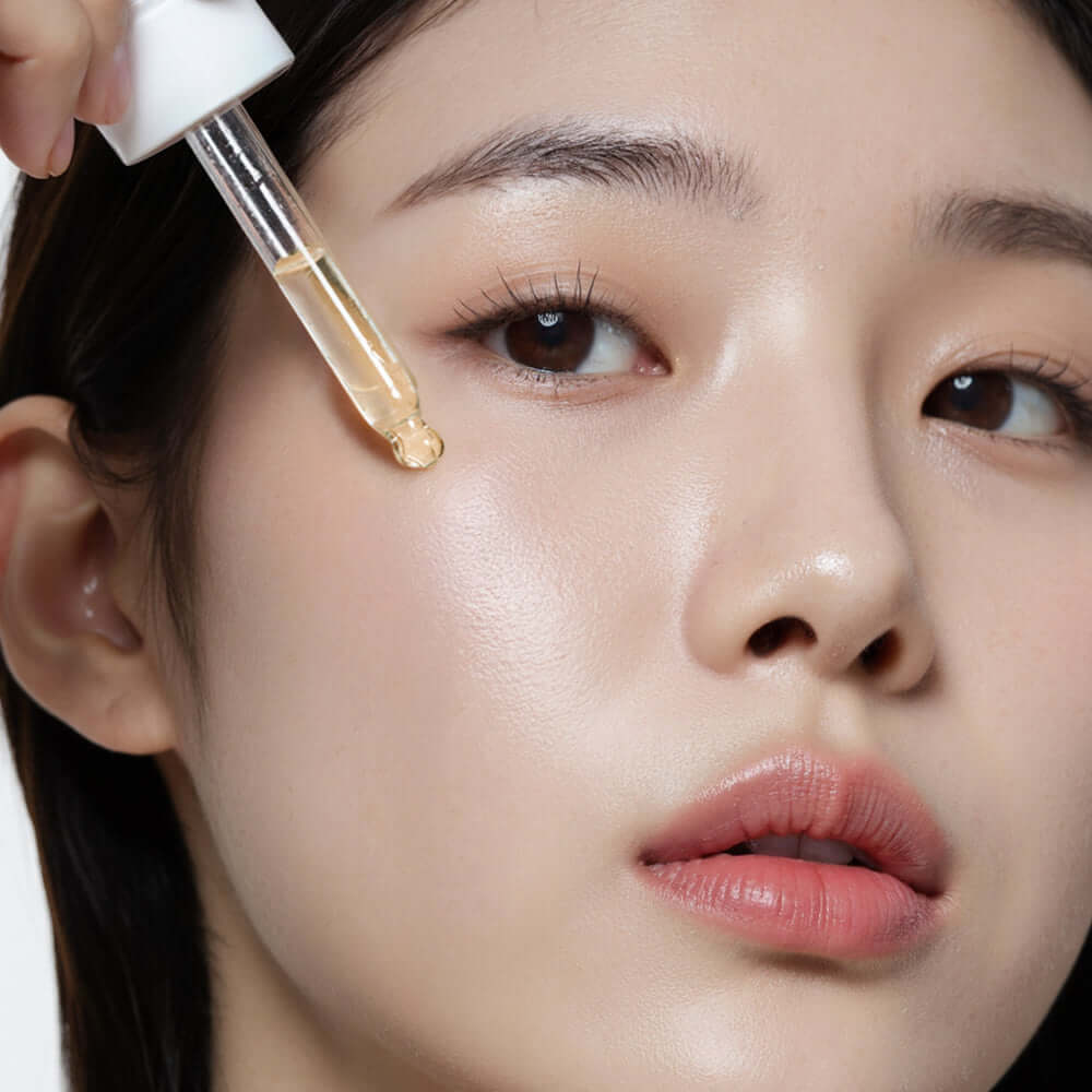 Applying HEIMISH RX Multi Vitamin Glow Serum 35ml to skin for radiant glow