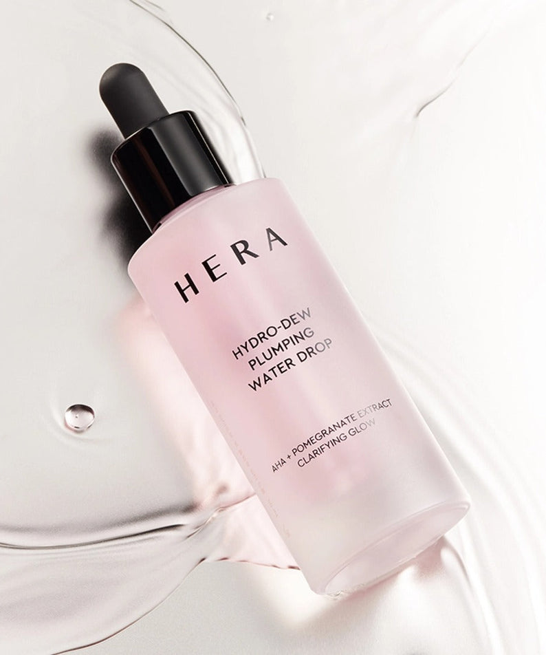 HERA Hydro-Dew Pluming Water Drop 50ml bottle on a light background highlighting its skincare benefits.