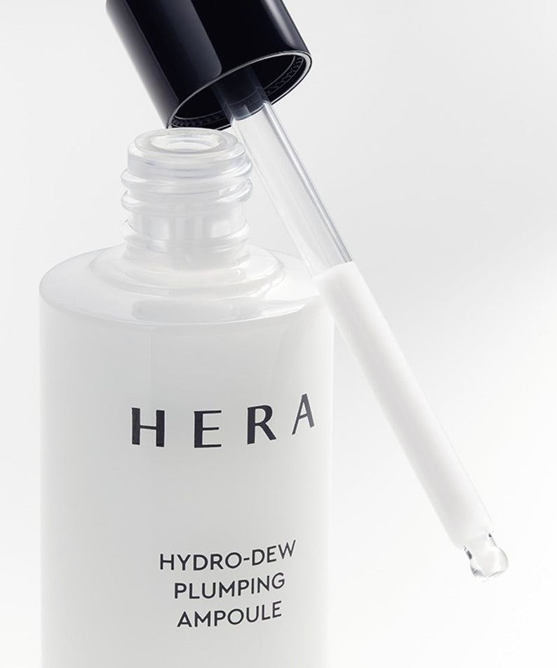 HERA Hydro-Dew Plumping Ampoule 50ml with dropper, luxury skincare product for hydration and plumping.