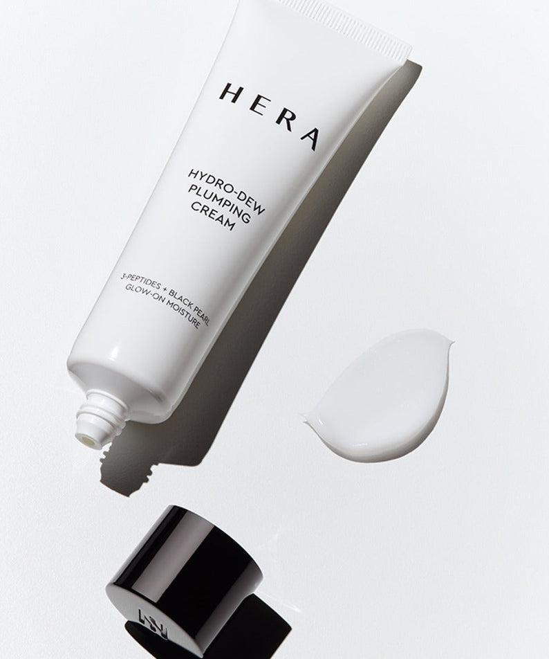 HERA Hydro-Dew Plumping Cream 50ml tube with cap and cream swatch on a white background.