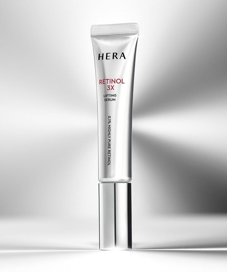 HERA Retinol 3X Lifting Serum 25ml in sleek packaging on a reflective surface